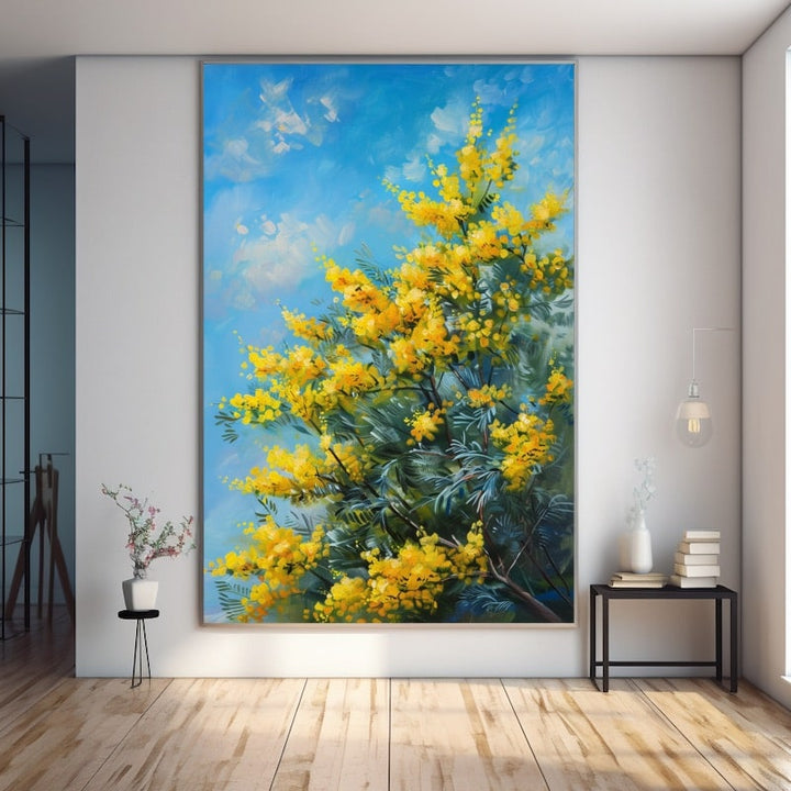 Tableau d'un mimosa en fleurs aux pompons jaunes vifs, feuillage vert-de-gris et ciel bleu azur
